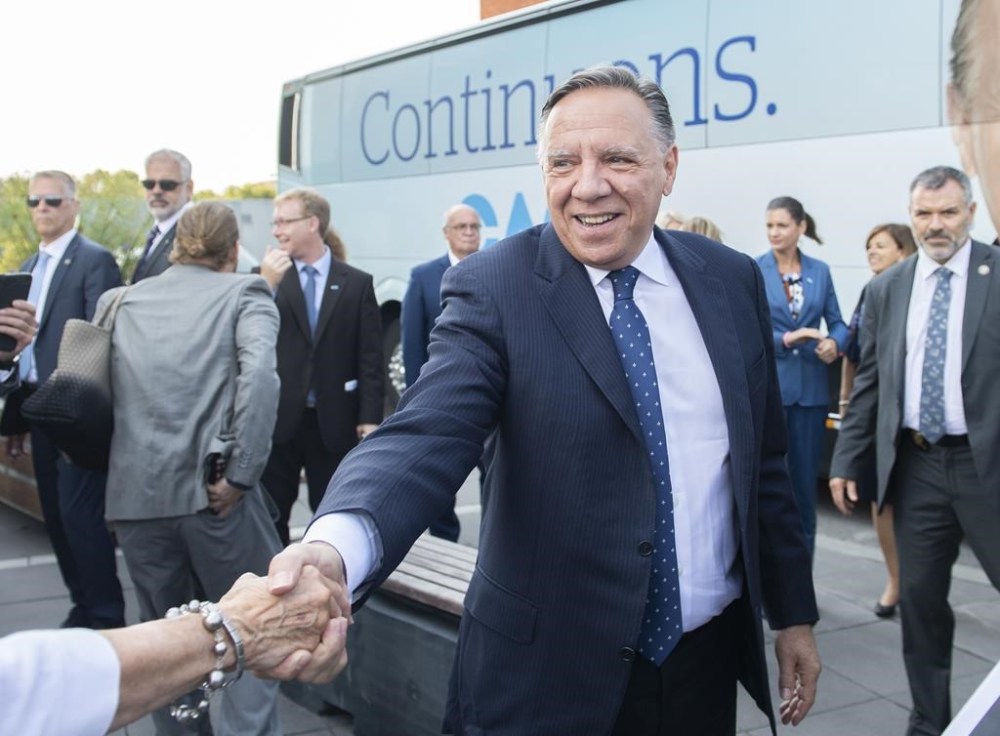 Coalition Avenir Québec Leader François Legault greets a supporter during an election campaign stop in Saint-Jérôme, Que., Saturday, Sept. 10, 2022. THE CANADIAN PRESS/Graham Hughes
