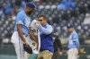 Kansas City Royals staff helps dry the arm of relief pitcher Amir Garrett during the sixth inning of a baseball game against the Detroit Tigers Saturday, Sept. 10, 2022, in Kansas City, Mo. (AP Photo/Jay Biggerstaff)