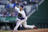 Texas Rangers starting pitcher Kohei Arihara throws to a Toronto Blue Jays batter during the first inning of baseball game in Arlington, Texas, Saturday, Sept. 10, 2022. (AP Photo/Tony Gutierrez)