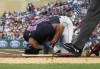 Cleveland Guardians' Will Benson goes down after being hit by a pitch from Minnesota Twins pitcher Chris Archer in the third inning of a baseball game, Saturday, Sept 10, 2022, in Minneapolis. (AP Photo/Jim Mone)