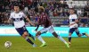 Colorado Rapids forward Gyasi Zardes, center, pursues the ball between Vancouver Whitecaps defender Ranko Veselinović, left, and midfielder Andrés Cubas during the first half of an MLS soccer match Saturday, Sept. 10, 2022, in Commerce City, Colo. (AP Photo/Bart Young)