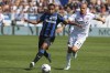 Atalanta's Luis Muriel, left, and Cremonese's Vlad Chiriches vie for the ball during the Italian Serie A soccer match between Atalanta and Cremonese, at the Gewiss Stadium in Bergamo, Italy, Sunday, Sept. 11, 2022. (StefanoNicoli/LaPresse via AP)