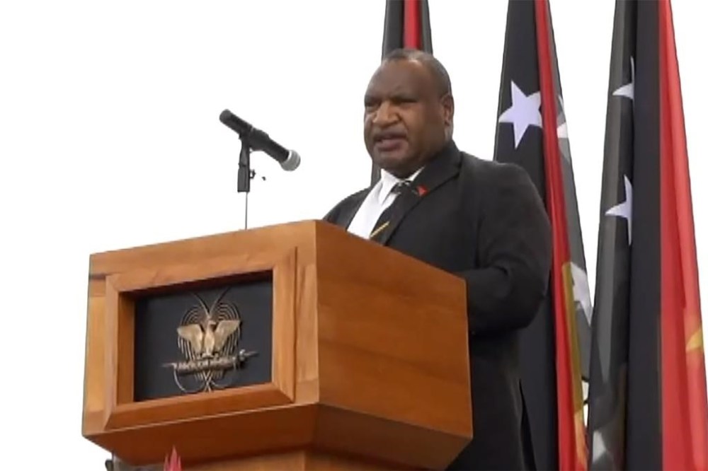 In an image taken from video, Papua New Guinea Prime Minister James Marape speaks during a ceremony marking the passing of Britain's Queen Elizabeth, Tuesday, Sept. 13, 2022, in Port Moresby, Papua New Guinea. Papua New Guinea leaders held a ceremony on Tuesday to farewell Queen Elizabeth II and to proclaim King Charles III as the country’s new head of state. (Australian Broadcasting Corporation via AP)