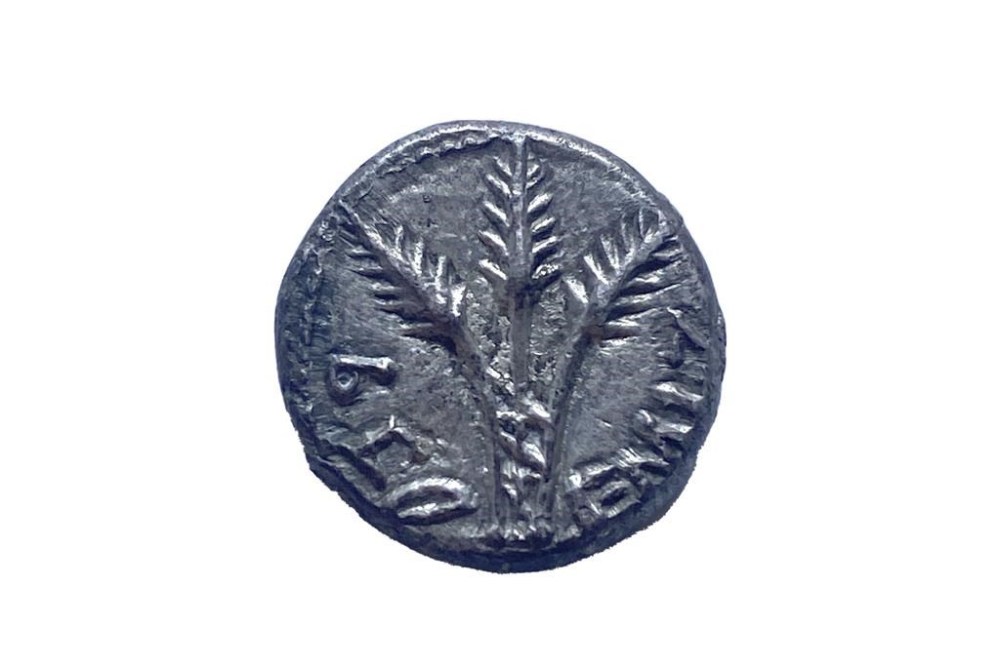 This undated photo, taken in New York, shows a rare, 2,000-year-old Jewish coin that U.S. authorities have returned to Israel nearly two decades after it was looted, smuggled and put up for auction in the United States. The quarter shekel silver coin, minted in the year 69, is believed to be one of just two confirmed to exist. (Israel's Antiquities Authority via AP)