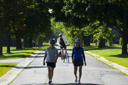 People make their way along Morningside Lane in Ottawa on Wednesday, July 13, 2022.Don’t put away your summer clothing just yet; the Weather Network says there are still some warm days ahead.&nbsp;THE CANADIAN PRESS/Sean Kilpatrick