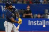 Tampa Bay Rays designated hitter Randy Arozarena hits a single off Toronto Blue Jays' starting pitcher Julian Merryweather in first inning American League baseball action during the first game of a double header in Toronto, Tuesday, Sept. 13, 2022. THE CANADIAN PRESS/Jon Blacker