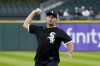Golfer Bryson DeChambeau throws out a ceremonial first pitch before a baseball game between the Chicago White Sox and the Colorado Rockies on Tuesday, Sept. 13, 2022, in Chicago. (AP Photo/Charles Rex Arbogast)