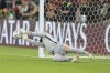 FILE - Australia's goalkeeper Andrew Redmayne saves during a penalty shoot out during the World Cup 2022 qualifying play-off soccer match between Australia and Peru in Al Rayyan, Qatar on June 13, 2022. Australia coach Graham Arnold has drafted in eight fresh players and welcomed Mitch Langerak’s decision to come out of retirement and join fellow goalkeepers Mat Ryan and Andrew Redmayne in a 31-player squad for the Socceroos’ World Cup warmup games against New Zealand. (AP Photo/Hussein Sayed, File)