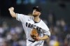 Arizona Diamondbacks starting pitcher Merrill Kelly throws to a Los Angeles Dodgers batter during the first inning of a baseball game in Phoenix, Tuesday, Sept. 13, 2022. (AP Photo/Ross D. Franklin)