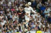 Real Madrid's Federico Valverde, right, goes for a header with Leipzig's David Raum during the Champions League group F soccer match between Real Madrid and Leipzig at the Santiago Bernabeu stadium in Madrid, Wednesday, Sept. 14, 2022. (AP Photo/Manu Fernandez)