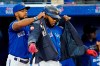 Toronto Blue Jays first baseman Vladimir Guerrero Jr., right, is congratulated on his solo home run against the Tampa Bay Rays by teammate Teoscar Hernandez, left, during first inning MLB action in Toronto, Wednesday, Sept. 14, 2022. THE CANADIAN PRESS/Frank Gunn