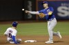 Chicago Cubs' Patrick Wisdom turns the double play forcing out New York Mets' Mark Canha (19) and getting Francisco Lindor at first during the eighth inning of a baseball game on Wednesday, Sept. 14, 2022, in New York. (AP Photo/Adam Hunger)