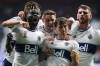 Vancouver Whitecaps' Leonard Owusu, from left to right, Jake Nerwinski, Ryan Gauld and Tristan Blackmon celebrate Gauld's goal against the Los Angeles Galaxy during the second half of an MLS soccer game in Vancouver, on Wednesday, September 14, 2022. THE CANADIAN PRESS/Darryl Dyck