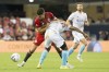 Toronto FC's Jonathan Osorio (left) battles for the ball with New England Revolution's DeJuan Jones during second half MLS action in Toronto on August 17, 2022. Osorio, who has missed the last four games, revealed Thursday he has been dealing with the effects of an elbow he took to the head from Chicago Fire star Xherdan Shaqiri in a July 13 game. THE CANADIAN PRESS/Chris Young