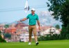 Rory McIlroy of Northern Ireland collects his ball after scoring an eagle on the third hole during the Italian Open at Guidonia Montecelio, near Rome, Thursday, Sep. 15, 2022. (AP Photo/Domenico Stinellis)