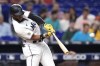 Miami Marlins' Bryan De La Cruz hits a three-run home run during the fourth inning of the team's baseball game against the Philadelphia Phillies, Thursday, Sept. 15, 2022, in Miami. (AP Photo/Lynne Sladky)