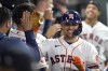 Houston Astros' Aledmys Diaz celebrates with teammates in the dugout after hitting a two-run home run against the Oakland Athletics during the seventh inning of a baseball game Thursday, Sept. 15, 2022, in Houston. (AP Photo/David J. Phillip)