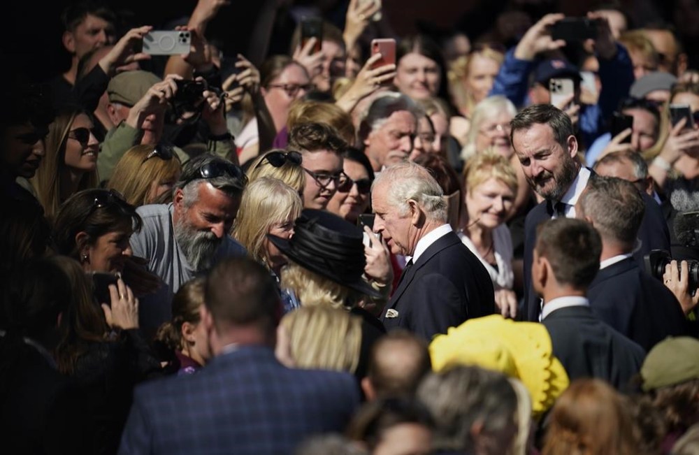 King Charles III, centre, and Camilla, the Queen Consort meets members of the public as he leaves the Senedd, after a visit to receive a Motion of Condolence following the death of Queen Elizabeth II, in Cardiff, Wales, Friday, Sept. 16, 2022. King Charles III and Camilla, the Queen Consort, arrived in Wales for an official visit. The royal couple previously visited to Scotland and Northern Ireland, the other nations making up the United Kingdom, following the death of Queen Elizabeth II at age 96 on Thursday, Sept. 8. (Andrew Matthews/PA via AP)