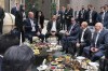 In this photo provided by the Turkish Presidency, Turkey's President Recep Tayyip Erdogan, centre left speaks to Azerbaijani President Ilham Aliyev, Uzbek President Shavkat Mirziyoyev, Russian President Vladimir Putin, Belarusian President Alexander Lukashenko and Iranian President Ebrahim Raisi, at the Shanghai Cooperation Organisation (SCO) summit in Samarkand, Uzbekistan, Thursday, Sept. 15, 2022. (Turkish Presidency via AP)