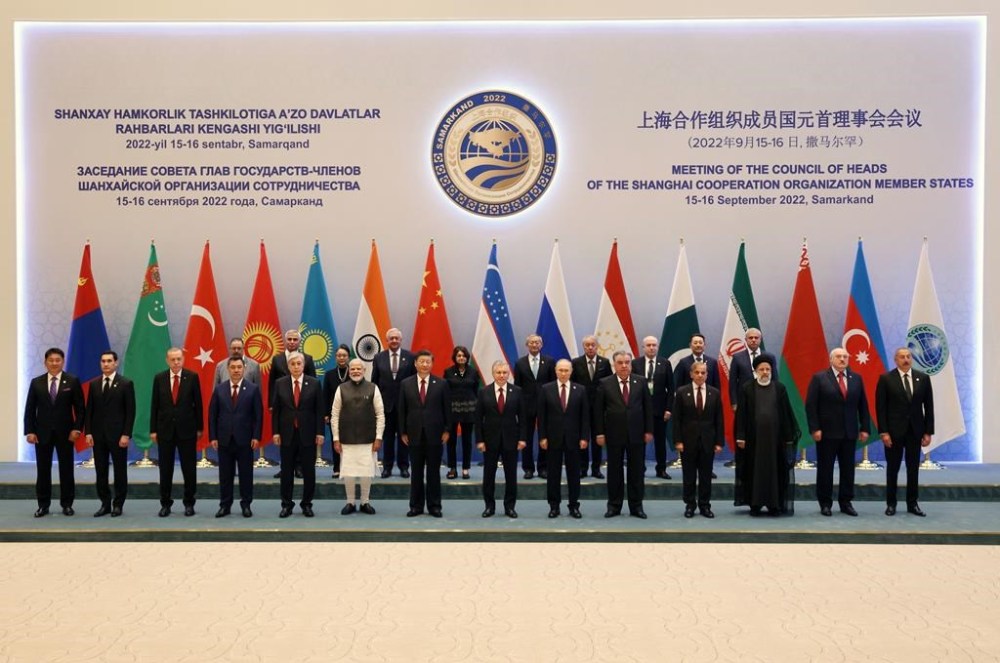 Leaders and participants from the left in the front row: Secretary-General of the Shanghai Cooperation Organisation Zhang Ming, Turkmen President Serdar Berdymukhamedov, Turkey's President Recep Tayyip Erdogan, Kyrgyz President Sadyr Japarov, Kazakhstan's President Kassym-Jomart Tokayev, Indian Prime Minister Narendra Modi, Chinese President Xi Jinping, Uzbek President Shavkat Mirziyoyev, Russian President Vladimir Putin, Tajikistan's President Emomali Rahmon, Pakistani Prime Minister Shahbaz Sharif, Iranian President Ebrahim Raisi, Belarusian President Alexander Lukashenko and Azerbaijani President Ilham Aliyev pose for a photo at the Shanghai Cooperation Organisation (SCO) summit in Samarkand, Uzbekistan, Friday, Sept. 16, 2022. (Sergei Bobylev, Sputnik, Kremlin Pool Photo via AP)