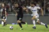 Salernitana's Krzysztof Piatek, left, goes for the ball during the Serie A soccer match between Salernitana and Lecce, at the Arechi stadium in Salerno, Italy, Friday, Sept. 16, 2022. (Alessandro Garofalo/LaPresse via AP)