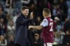 Aston Villa's head coach Steven Gerrard celebrates with Aston Villa's Lucas Digne at the end of the English Premier League soccer match between Aston Villa and Southampton at Villa Park in Birmingham, England, Friday, Sept. 16, 2022. Aston Villa won 1-0. (AP Photo/Rui Vieira)