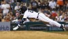Detroit Tigers' Javier Baez dives into third base with a triple against the Chicago White Sox during the fifth inning of a baseball game Friday, Sept. 16, 2022, in Detroit. (AP Photo/Duane Burleson)