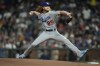 Los Angeles Dodgers pitcher Dustin May throws to a San Francisco Giants batter during the first inning of a baseball game Friday, Sept. 16, 2022, in San Francisco. (AP Photo/Tony Avelar)