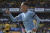 Manchester City's Phil Foden celebrates after scoring his side's 3rd goal during the English Premier League soccer match between Wolverhampton Wanderers and Manchester City at Molineux stadium in Wolverhampton, England, Saturday, Sept. 17, 2022. (AP Photo/Rui Vieira)