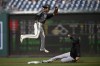 Miami Marlins' Charles Leblanc, bottom, steals second against Washington Nationals shortstop CJ Abrams, top, during the first inning of a baseball game, Saturday, Sept. 17, 2022, in Washington. (AP Photo/Nick Wass)