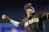 San Diego Padres third baseman Manny Machado throws the ball back to the pitcher during the first inning of the team's baseball game against the Arizona Diamondbacks in Phoenix, Saturday, Sept. 17, 2022. (AP Photo/Ross D. Franklin)