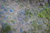 Nearly five years after Hurricane Maria struck Puerto Rico, pieces of blue roof tarp litter the ground in Loiza, Puerto Rico, Thursday, Sept. 15, 2022. The government has completed only 21% of more than 5,500 post-hurricane projects. In addition, more than 3,600 homes still have a tattered blue tarp serving as a makeshift roof. (AP Photo/Alejandro Granadillo)