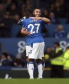 Everton's Neal Maupay celebrates scoring their side's first goal of the game with team-mate Idrissa Gueye during the English Premier League soccer match between Everton and West Ham, at Goodison Park, Liverpool, England, Sunday Sept. 18, 2022. (Isaac Parkin/PA via AP)
