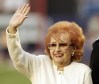 FILE - Joan Hodges, widow of New York Mets great Gil Hodges, waves to fans as the Mets honored Gil before a baseball game against the Houston Astros, Sept. 7, 2007, at Shea Stadium in New York. Joan has died following a long illness. The team said she died Saturday, Sept. 17, 2022, 10 days shy of her 96th birthday. (AP Photo/Ed Betz, File)