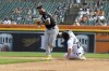 Chicago White Sox third baseman Yoan Moncada, left, forces out Detroit Tigers' Spencer Torkelson out at second base in the fourth inning of a baseball game, Sunday, Sept. 18, 2022, in Detroit. (AP Photo/Jose Juarez)
