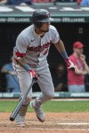 Minnesota Twins' Luis Arraez watches his two-run RBI single off Cleveland Guardians relief pitcher Enyel De Los Santos during the ninth inning of a baseball game in Cleveland, Sunday, Sept. 18, 2022. (AP Photo/Phil Long)