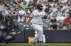 Milwaukee Brewers' Rowdy Tellez watches his home run during the eighth inning of a baseball game against the New York Yankees, Sunday, Sept. 18, 2022, in Milwaukee. (AP Photo/Kenny Yoo)