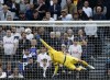 Tottenham's goalkeeper Hugo Lloris dives but fails to save the goal from Leicester's James Maddison during the English Premier League soccer match between Tottenham Hotspur and Leicester City at Tottenham Hotspur Stadium, in London, Saturday, Sept. 17, 2022. (AP Photo/David Cliff)