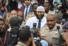 Adnan Syed, center, the man whose legal saga spawned the hit podcast 