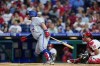 Toronto Blue Jays' Alejandro Kirk follows through after hitting a run-scoring single against Philadelphia Phillies pitcher Kyle Gibson during the second inning of a baseball game, Tuesday, Sept. 20, 2022, in Philadelphia. (AP Photo/Matt Slocum)