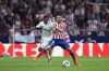 Real Madrid's Rodrygo, left, battles for the ball with Atletico Madrid's Koke during the Spanish La Liga soccer match between Atletico Madrid and Real Madrid at the Wanda Metropolitano stadium in Madrid, Spain, Sunday, Sept. 18, 2022. (AP Photo/Manu Fernandez)