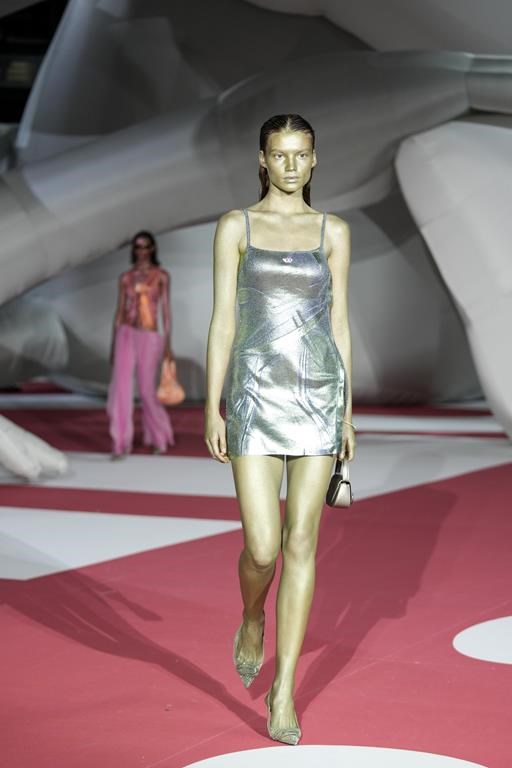 A model wears a creation as part of the Diesel women's Spring Summer 2023 collection presented in Milan, Italy, Wednesday, Sept. 21, 2022. (AP Photo/Antonio Calanni)
