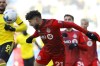 Toronto FC midfielder Jonathan Osorio heads the ball during the second half of an MLS soccer match against the Columbus Crew, in Columbus, Ohio, Saturday, March 12, 2022.&nbsp;While called up by Canada coach John Herdman, a Toronto FC spokeswoman says Osorio remained in Toronto 