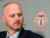 Earl Cochrane looks on at a press conference, in Toronto on Tuesday, Sept. 14, 2010.&nbsp;Canada Soccer has made a new offer to its players in a bid to resolve their ongoing contract impasse. Cochrane, Canada Soccer's general secretary, said a 