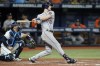 Houston Astros' Kyle Tucker (30) watches his two-run home run off Tampa Bay Rays relief pitcher Brooks Raley during the eighth inning of a baseball game Wednesday, Sept. 21, 2022, in St. Petersburg, Fla. Catching for the Rays is Rene Pinto. (AP Photo/Chris O'Meara)
