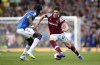 West Ham United's Declan Rice runs at Everton's Amadou Onana during the English Premier League soccer match between Everton and West Ham, at Goodison Park, Liverpool, England, Sunday Sept. 18, 2022. (Isaac Parkin/PA via AP)
