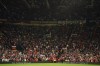 Manchester United fans observe a minutes silence following the death of Queen Elizabeth II, ahead of the group E Europa League soccer match between Manchester United and Real Sociedad at Old Trafford in Manchester, England, Thursday, Sept. 8, 2022. (AP Photo/Dave Thompson)