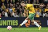 Australia's Riley McGree has a shot against New Zealand during a friendly soccer international in Brisbane, Australia, Thursday, Sept. 22, 2022. (AP Photo/Dan Peled)