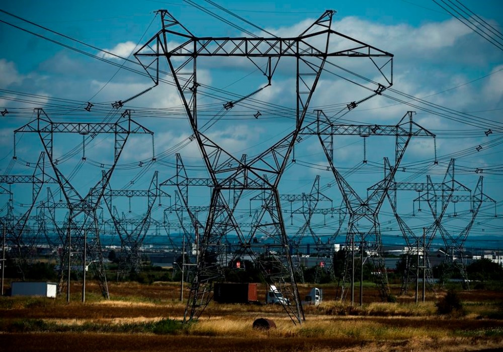 Rows of power lines are shown which people use for electricity in Mississauga, Ont., Monday, Aug. 19, 2019. Hydro One is offering First Nations a chance to invest in a 50 per cent equity stake in new capital transmission line projects worth more than $100 million. THE CANADIAN PRESS/Nathan Denette