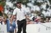 Corey Conners, of Canada, reacts to his shot off the 14th tee during their foursomes match at the Presidents Cup golf tournament at the Quail Hollow Club, Thursday, Sept. 22, 2022, in Charlotte, N.C. (AP Photo/Chris Carlson)